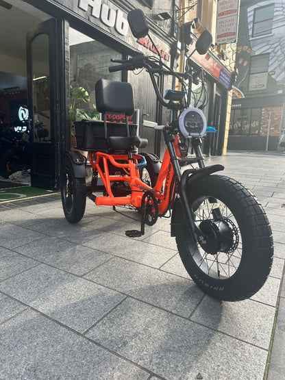 Front side view of the Meet One Tour 2.0 electric trike on an Irish street.